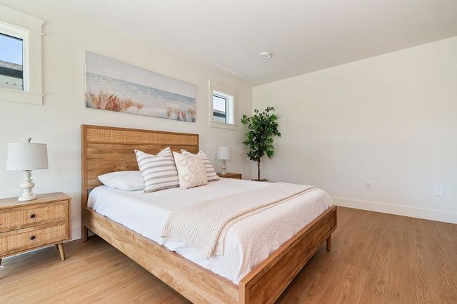 Bedroom with light wood-style flooring | Image 20