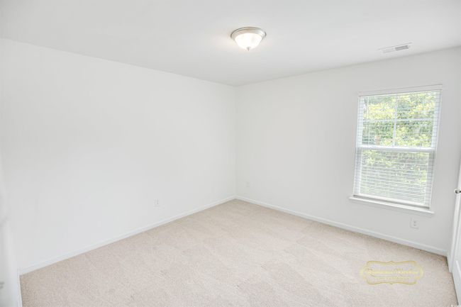 Unfurnished room with light carpet and baseboards | Image 29