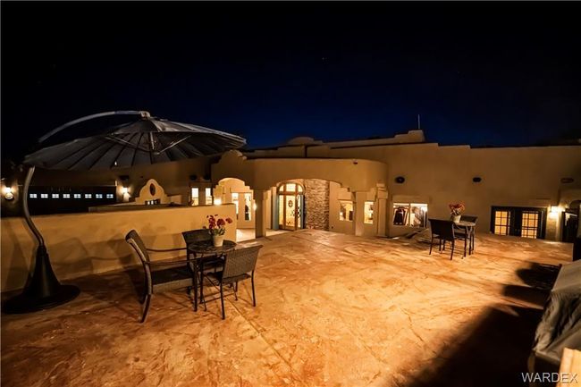 Patio at night featuring outdoor dining space and a patio | Image 21
