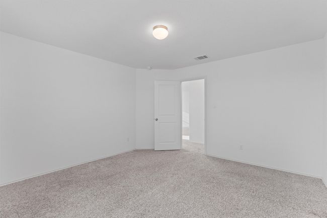 Spare room featuring carpet flooring and visible vents | Image 23