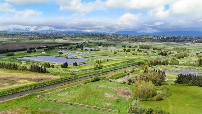 Aerial view with a water and mountain view and view of golf course | Image 34