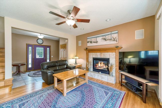 Main floor living room with gas fireplace | Image 6