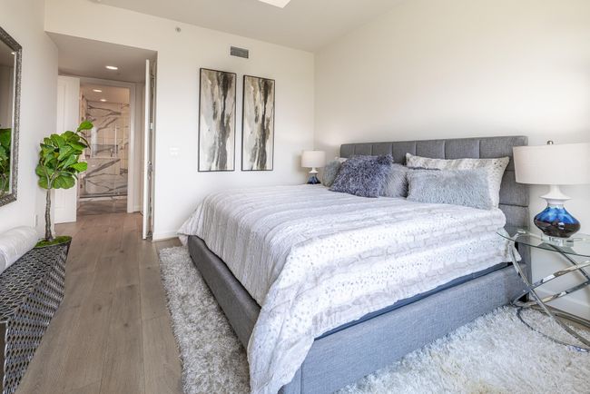 Inviting primary bedroom with abundant natural light. | Image 11