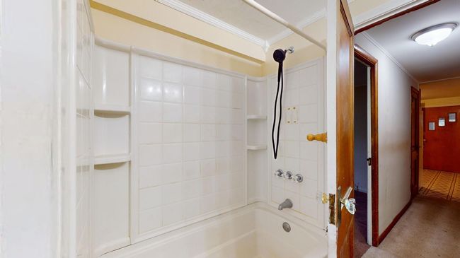 Bathroom with shower / tub combination and ornamental molding | Image 21