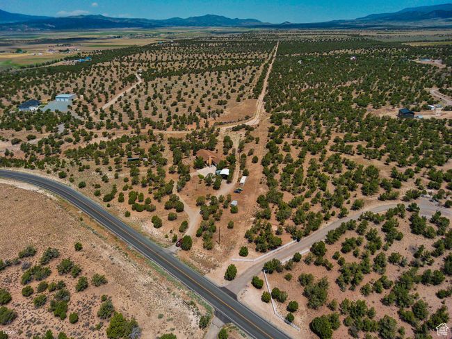 Aerial view of sparsely populated area with mountains | Image 54