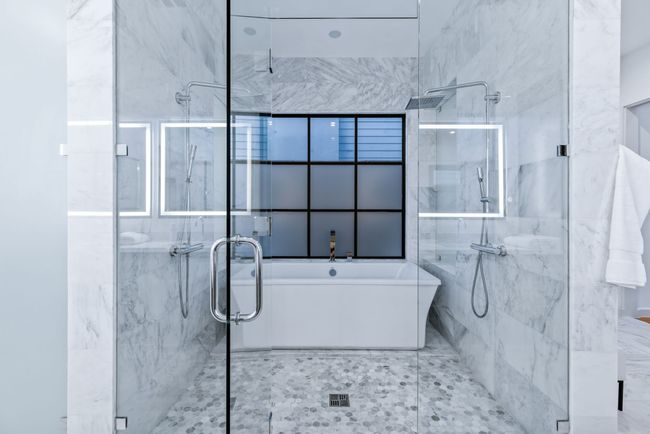 Bathroom with a marble finish shower and a freestanding​​‌​​​​‌​​‌‌​‌‌​​​‌‌​​‌‌​‌​​​​​‌ tub | Image 22