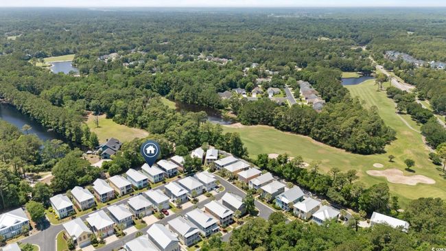 Aerial view of property's location with a large body of water, a golf club, and a forest | Image 34