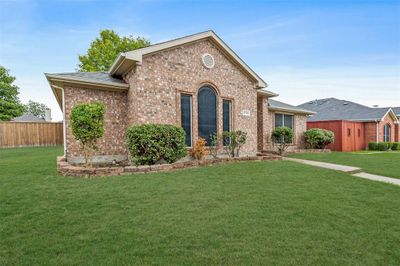 View of front facade with a front yard | Image 3