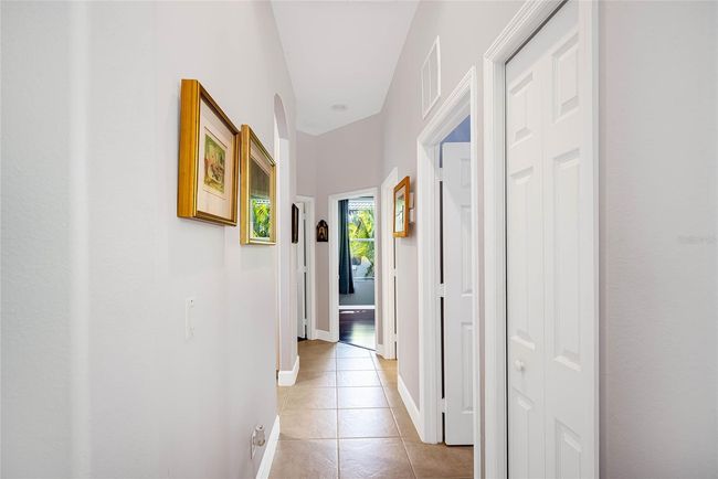 Hallway to back two bedrooms and 3rd bathroom. | Image 25