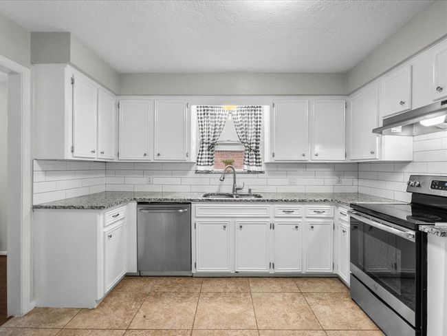Large window above sink bringing in natural light | Image 7