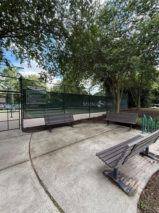 Tennis courts are in the Cardinal Sports Park. There are benches and a bike rack nearby, providing a welcoming spot for relaxation and recreation. | Image 36