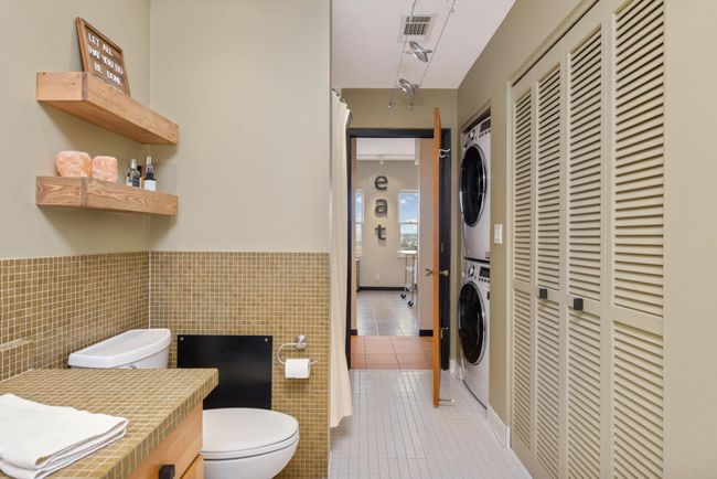 In unit laundry located in bathroom. | Image 25