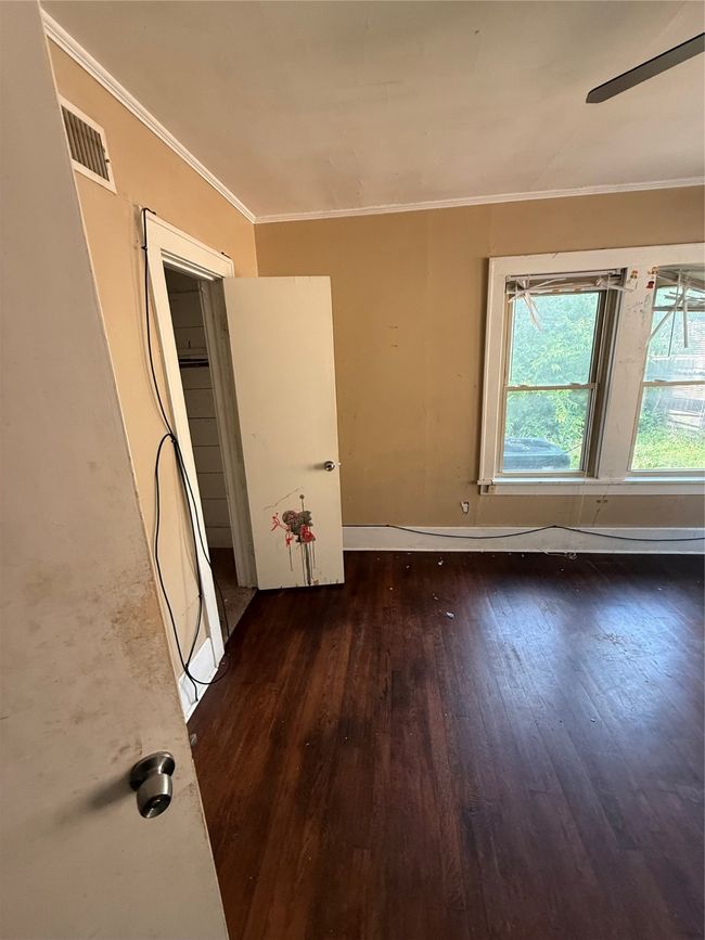 Unfurnished room with wood-type flooring and crown molding | Image 5