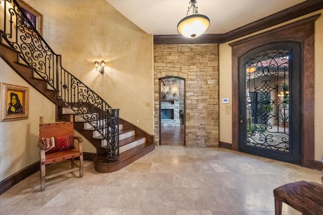Entryway with stairway, baseboards, and travertine floors | Image 15
