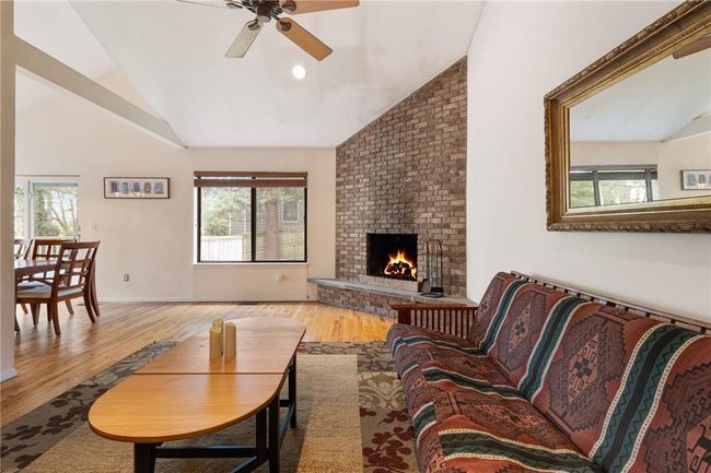 Living room with stone fpl & hardwood floors | Image 8