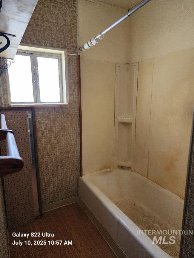 Bathroom featuring washtub / shower combination | Image 23