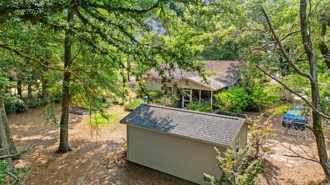 View of yard with an outbuilding | Image 25