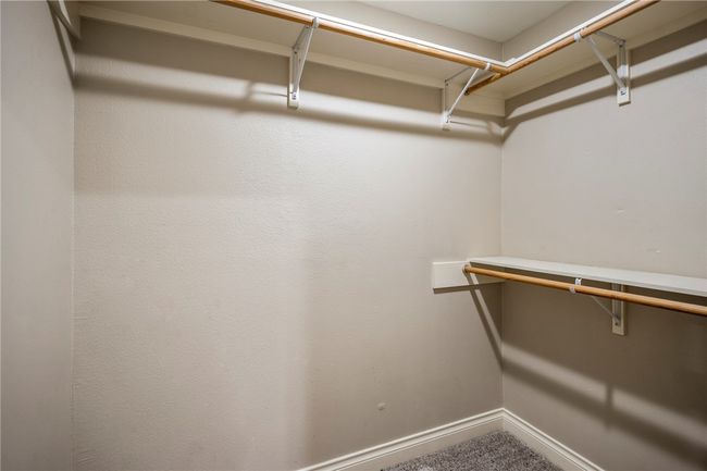 Spacious closet with carpet | Image 35