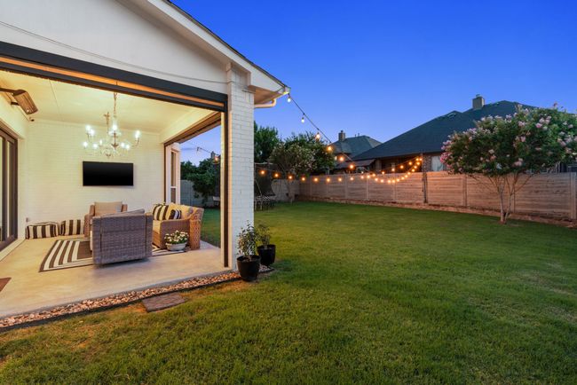 View of yard featuring a patio and outdoor lounge area | Image 40