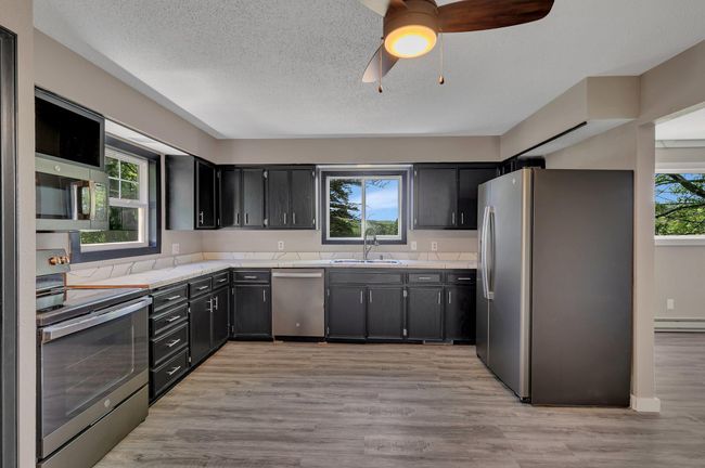 Newer SS appliances and updated fixtures throughout | Image 7