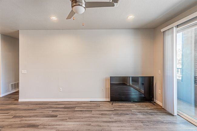 Spare room featuring ceiling fan, wood finished floors, and recessed lighting | Image 6