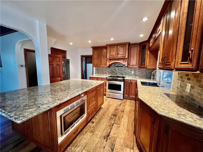 Kitchen with island. | Image 9