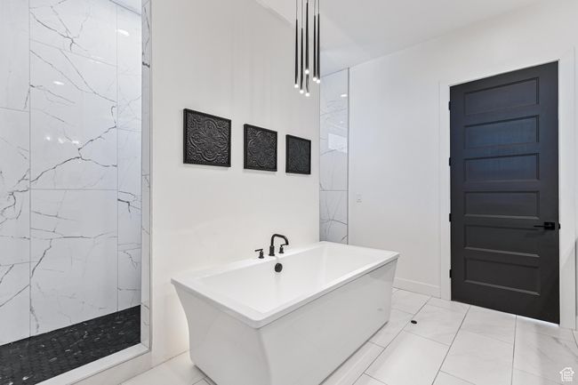 Full bath with a marble finish shower and a freestanding tub | Image 24