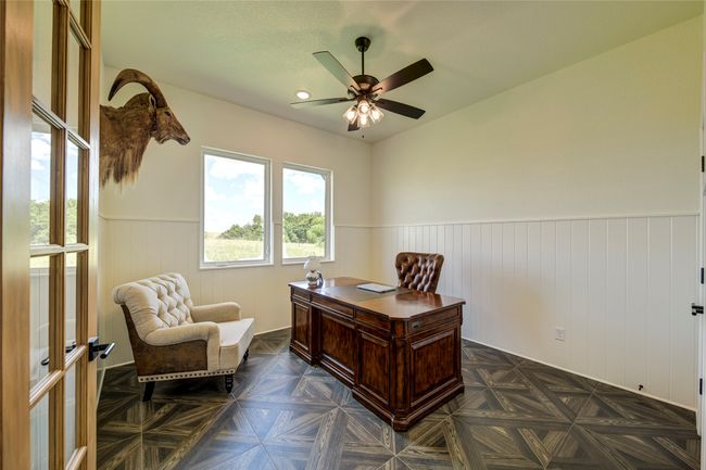 Office area featuring dark parquet floors and ceiling fan | Image 24