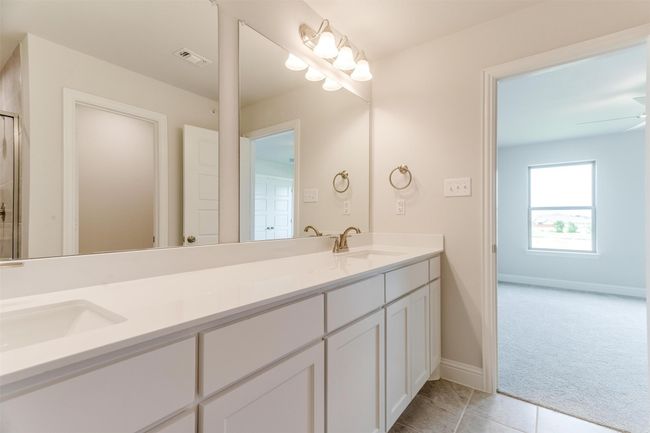 Bathroom featuring vanity, tile patterned floors, and ceiling fan | Image 24