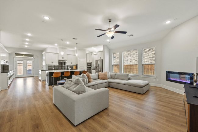 Open floor plan features dream kitchen opening onto family room | Image 12