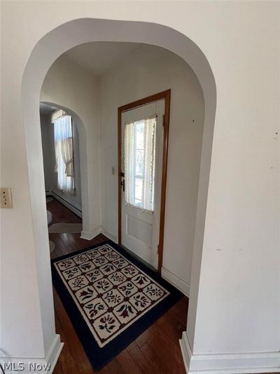 Foyer with dark hardwood / wood-style floors and baseboard heating | Image 3