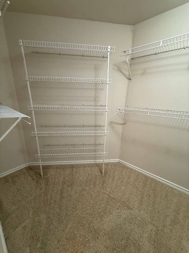 Walk in closet with carpet | Image 21