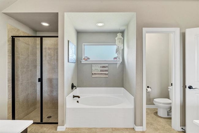 Bathroom featuring tile flooring, plus walk in shower, and toilet | Image 22