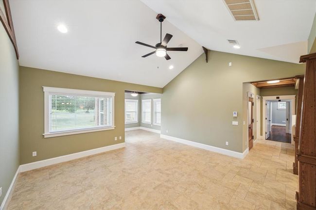 THIS VIEW IS FROM THE SECONDARY BEDROOMS LOOKING ACROSS THE SPLIT FLOOR PLAN TOWARDS THE PRIMARY SUITE | Image 11