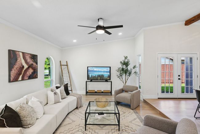 Living room with light wood-style flooring, french doors, recessed lighting, ceiling fan, and ornamental molding | Image 8