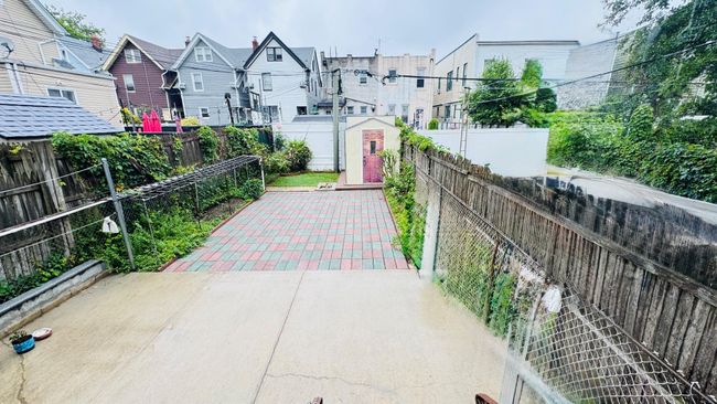 Fenced backyard with a patio and a residential view | Image 8