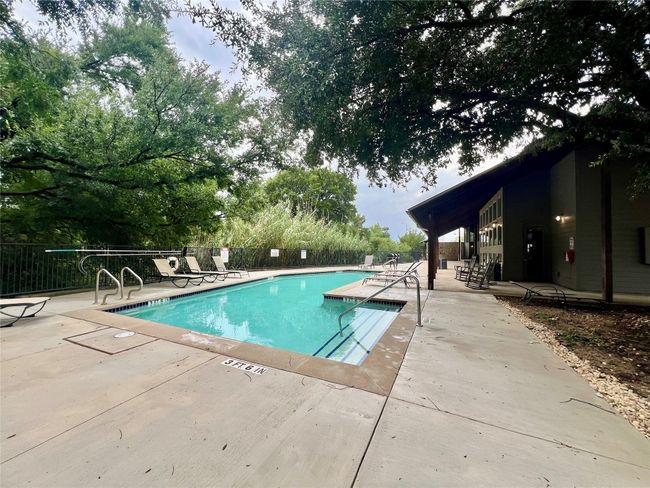 Community pool featuring a patio. | Image 37