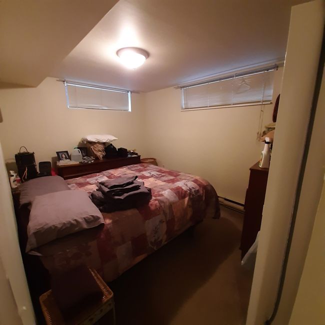 Bedroom with a baseboard heating unit | Image 11