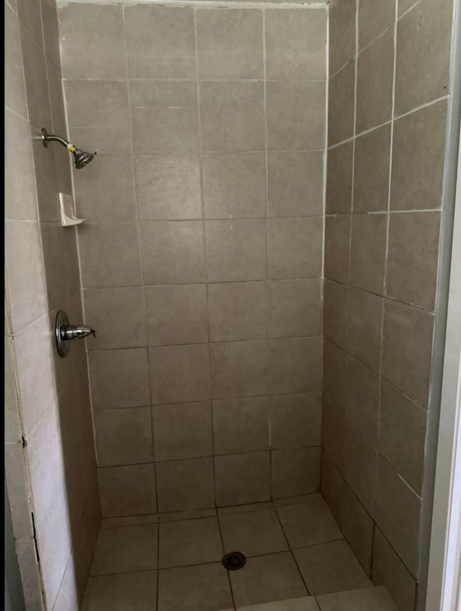 Bathroom with a tile shower | Image 23