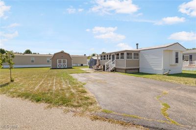 Manufactured / mobile home with a front lawn and a shed | Image 3