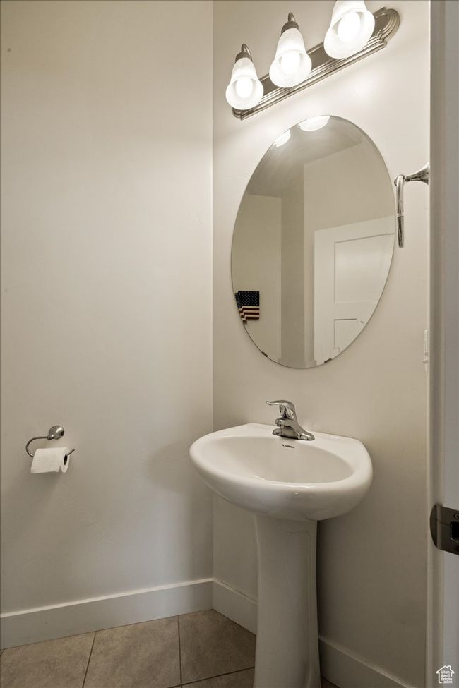 Bathroom featuring tile patterned floors and baseboards | Image 24