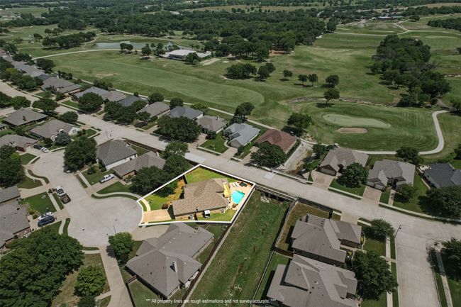 View of property location featuring a local golf course, property parcel outlined, nearby suburban area, and a nearby body of water | Image 33