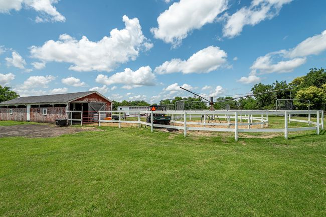View of yard featuring an exterior structure and an outdoor structure | Image 7
