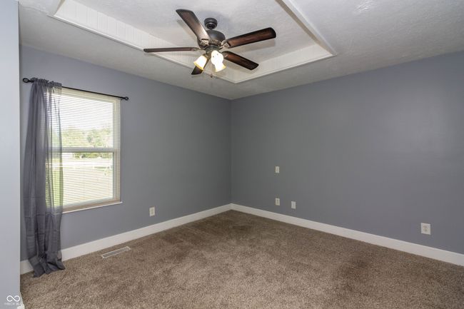 14 x 12 Primary Bedroom with walk in closet and private full bathroom. | Image 8