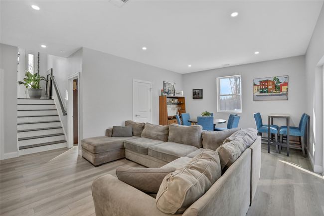 Living room featuring light wood-type flooring | Image 24