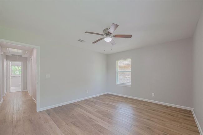 Light-toned flooring and soft neutral walls create a serene ambiance ideal for unwinding at the end of the day. | Image 19