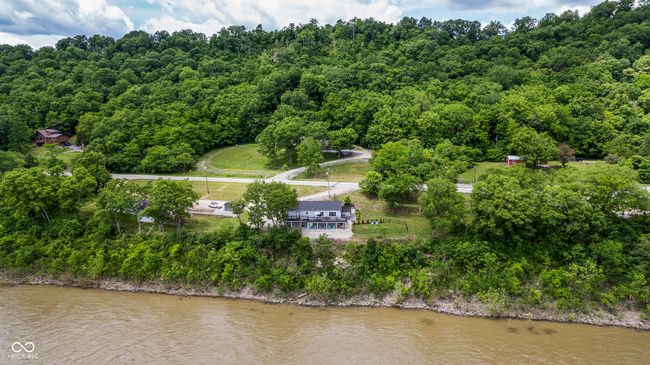 drone / aerial view of a large body of water and a forest | Image 68