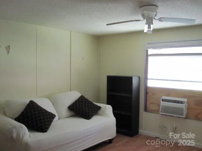 2nd bedroom has heat and air window unit | Image 16