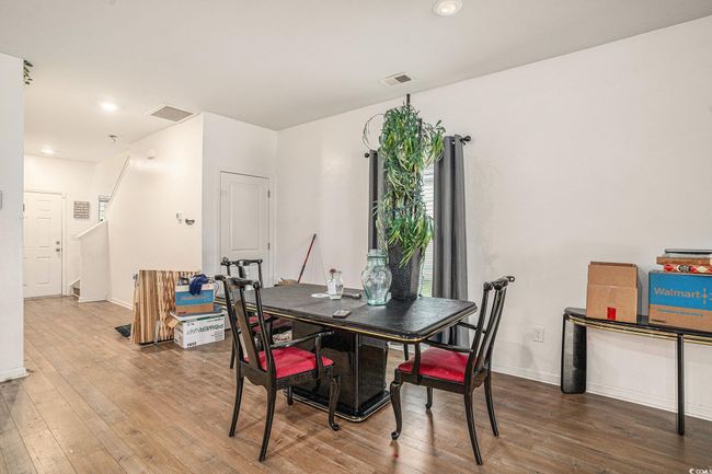 Dining space featuring wood finished floors, recessed lighting, and baseboards | Image 11