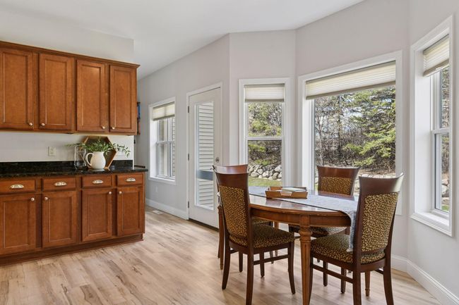 Sunny bay window in informal dining area. Back door access to future deck. | Image 15